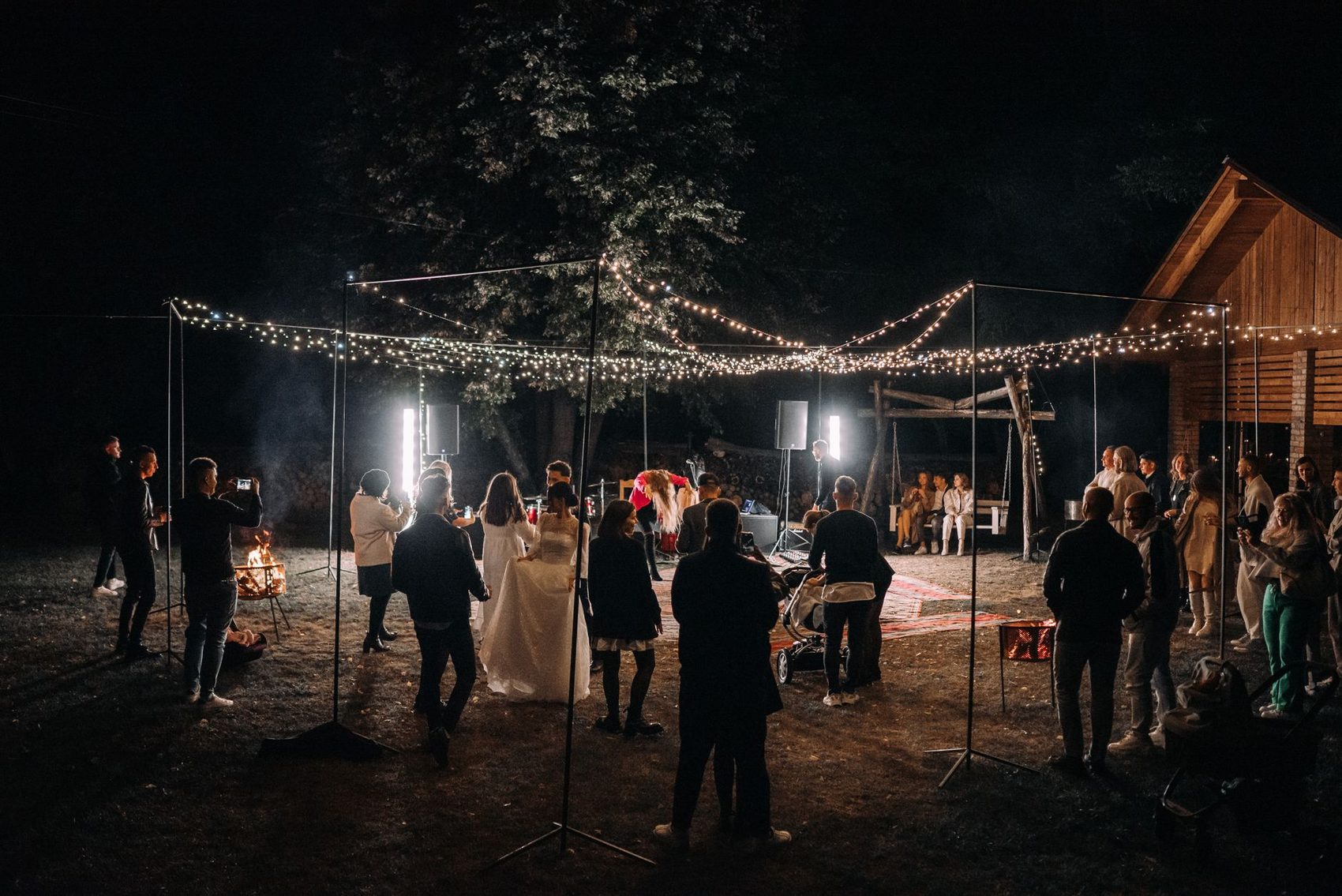 Reception under strung lights after dark