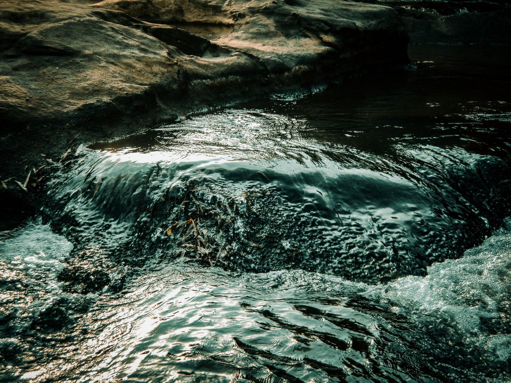 Clear water running over rock